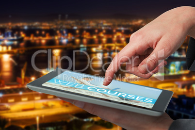 Composite 3d image of businesswoman hand using digital tablet