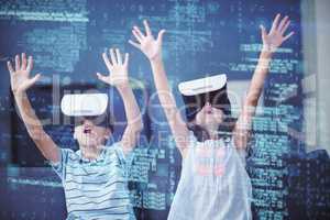 Siblings using virtual reality 3d headset in living room
