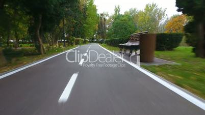 Aerial footage of road signs for the cyclists in autumn park