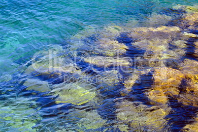 Transparent water of the mediterranean sea and stone