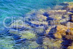 Transparent water of the mediterranean sea and stone