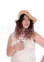 Woman holding glass with water.