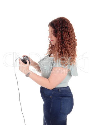 Woman playing her video game.