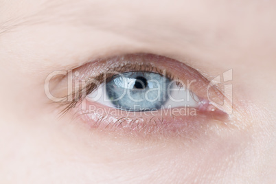 Closeup of woman's blue eye