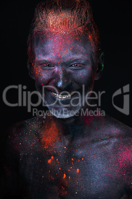 Portrait of a man painted in fluorescent UV colors.