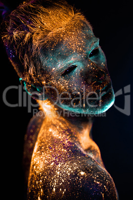 Portrait of a man painted in fluorescent UV colors.