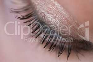 Closeup woman's eye with soft makeup