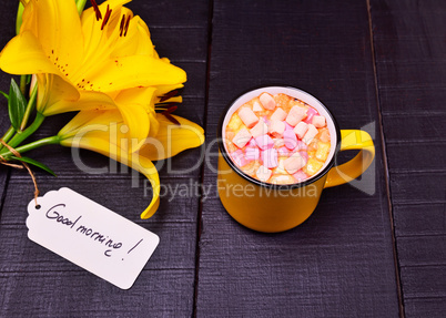 Cocoa with marshmallows in a yellow mug