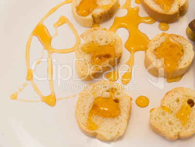 Healthy eating close-up of slices of toast with honey on plate