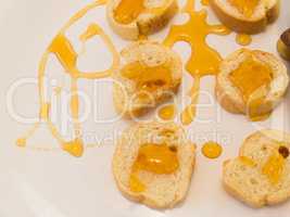 Healthy eating close-up of slices of toast with honey on plate