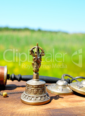 copper bell with Tibetan religious objects