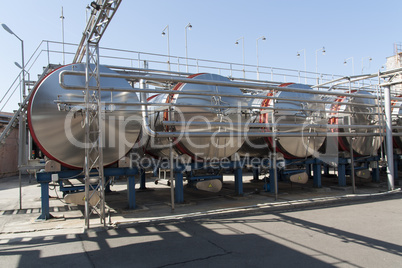 Modern aluminum barrels for wine in wine factory photo