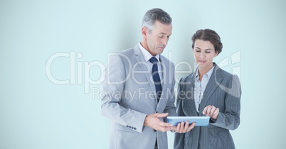 Business people using digital tablet over gray background