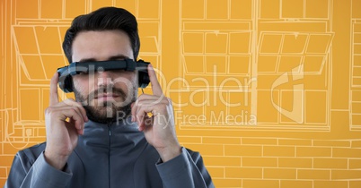 Man in virtual reality headset against orange and white hand drawn window