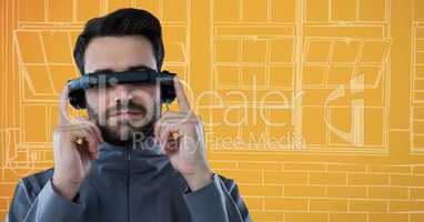 Man in virtual reality headset against orange and white hand drawn window