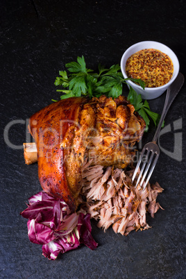 fresh roasted knuckle of pork with mustard