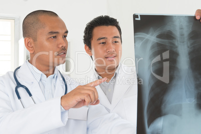 Medical doctors checking on x-ray image