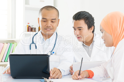 Medical doctors meeting at hospital office.