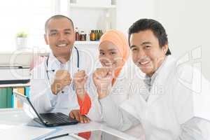 Asian doctors celebrating success