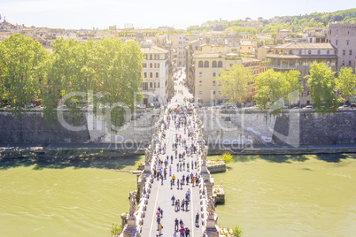 Saint Angel bridge over the river Tiber with tourists