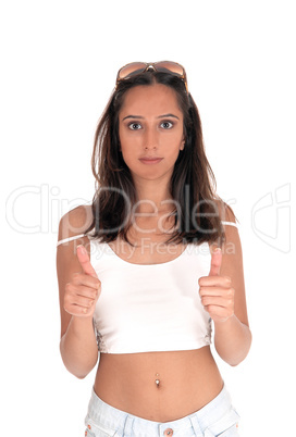 Young woman standing with thumbs up