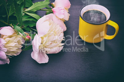 Black coffee in a yellow mug