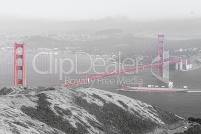 Cargo ship crossing the Golden Gate Bridge.