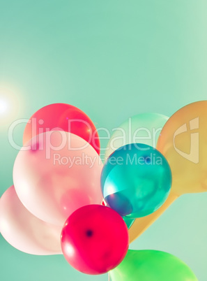 Multicolored balloons in the sun