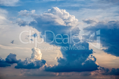 White cumulus clouds and a blue sky