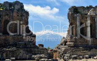 stage detail of the ancient theatre of Taormina with Etna mounta