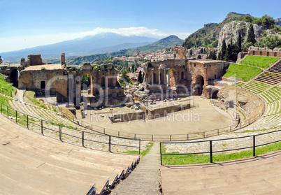 The famous and beautiful ancient greek theatre ruins Taormina wi
