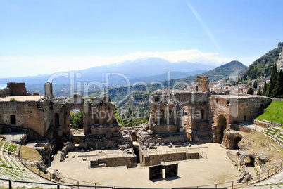 the Ancient Theatre of Taormina with Etna Mountain in background