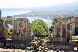 the Ancient Theatre of Taormina with Etna Mountain and mediterra