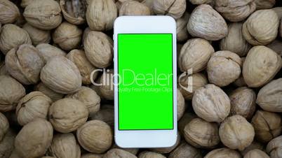 Motion of green screen phone on walnut background for cooking recipe concept