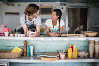 Waiter and waitress interacting with each other