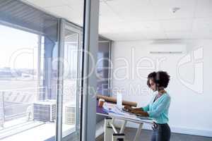Female architect working over laptop