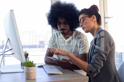 Executives discussing over mobile phone