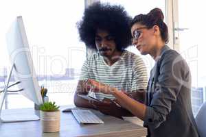 Executives discussing over mobile phone