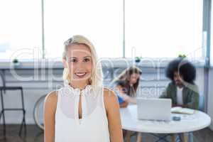 Female executive standing in office