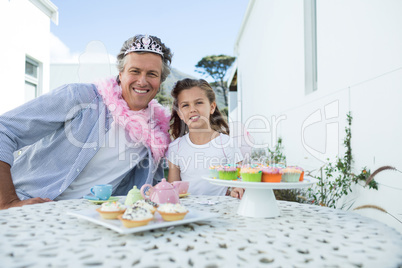 Smiling father and daughter in fairy costume