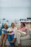 Smiling family watching television together in living room