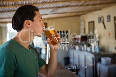 Young man drinking beer