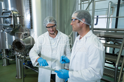 Scientists discussing in warehouse