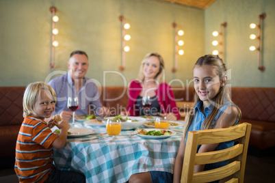 Portrait of happy family in restaurant