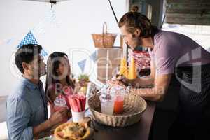 Customers giving order to waiter