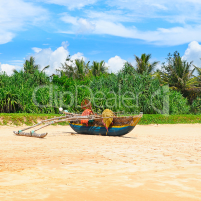 Sea beach and an old boat on the sand