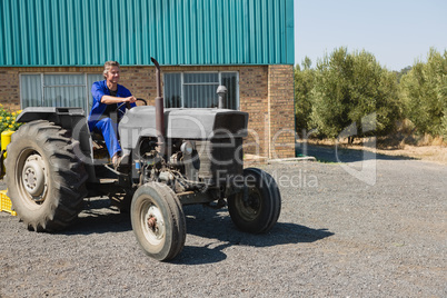 Attentive worker driving a tractor