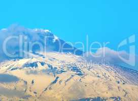 snow Etna mountain smoking steam in Sicily,