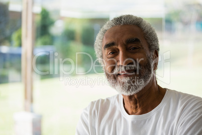 Smiling senior relaxing at home