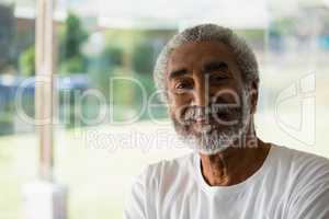 Smiling senior relaxing at home